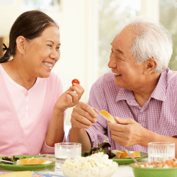 elderly couple easting a balanced meal