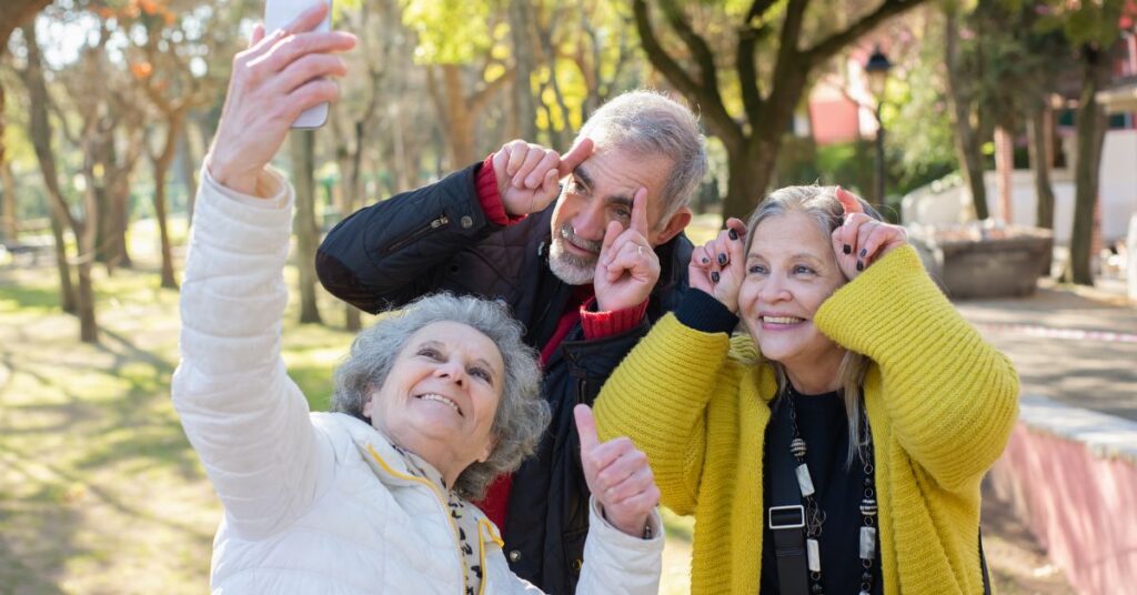 a group of old people taking a selfie