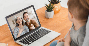a couple of grandparents talking to their grandson via video call