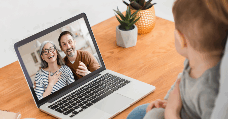 a couple of grandparents talking to their grandson via video call