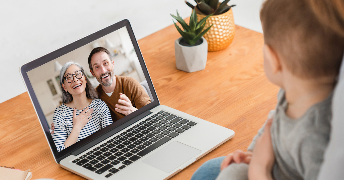 a couple of grandparents talking to their grandson via video call